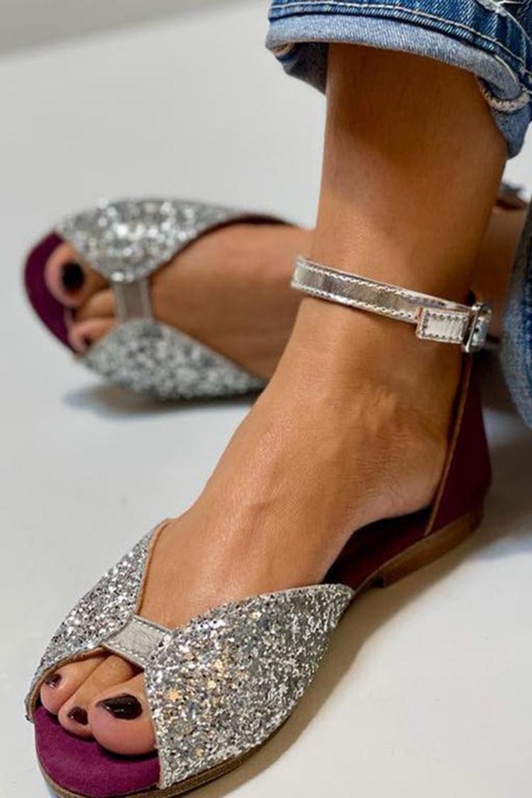 Greta – Glittrande platta sandaler med ankelrem