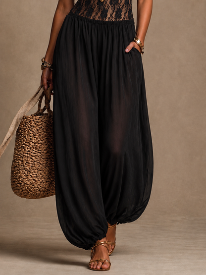Sibylla – Jumpsuit med spetskorsett och vida ben