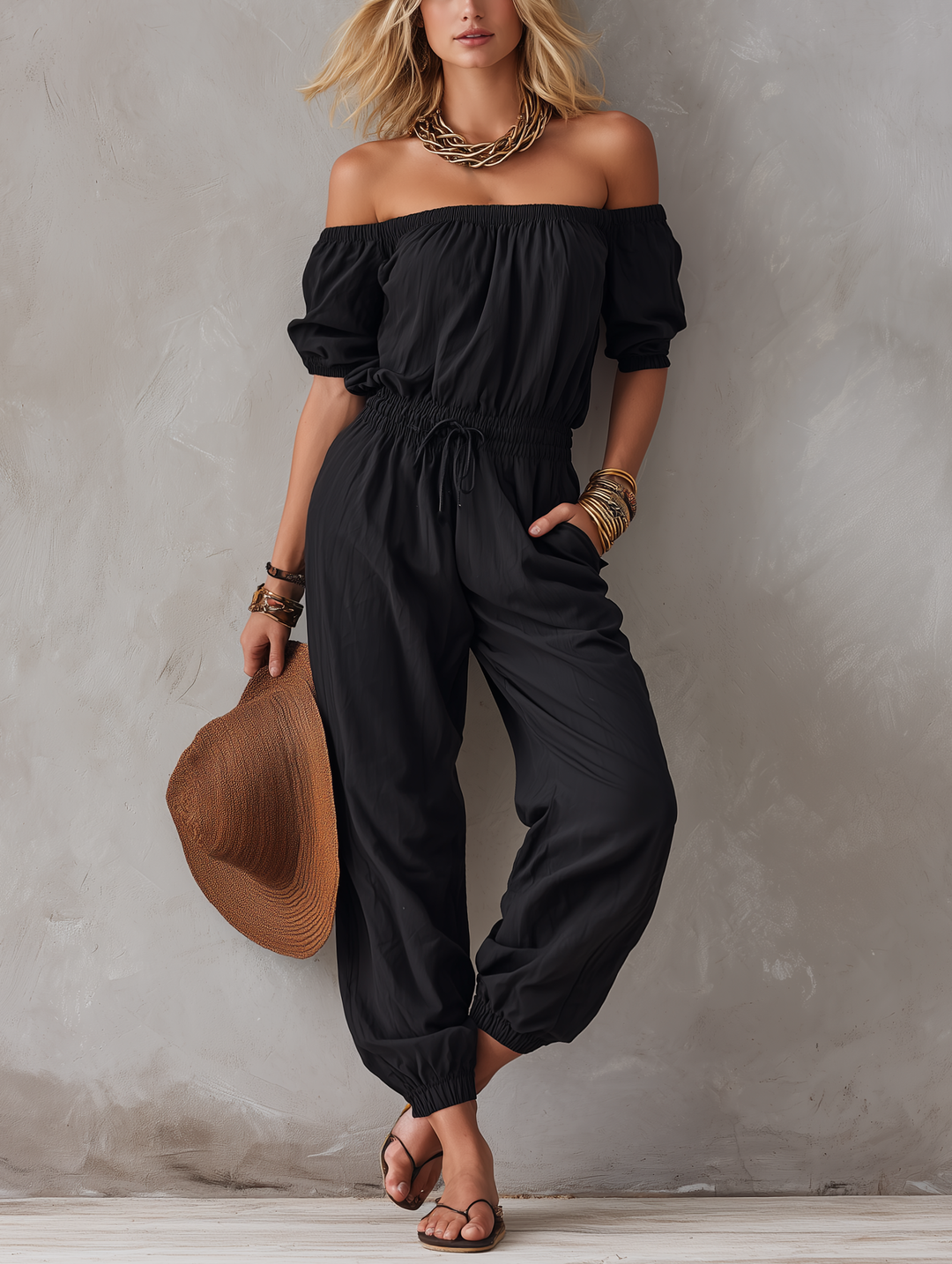Maj – Avslappnad jumpsuit med off-shoulder-ringning