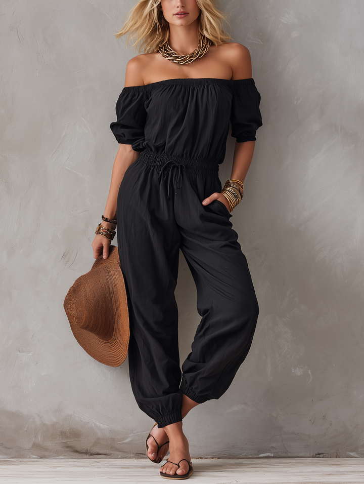 Maj – Avslappnad jumpsuit med off-shoulder-ringning