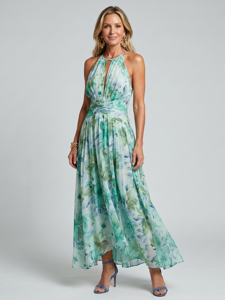 Petra – Plisserad halter midi-klänning med mjukt blommönster