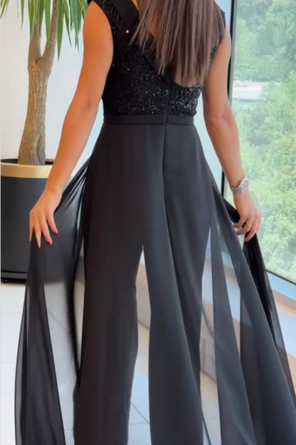 Margit – Festjumpsuit med chiffongkjol och paljetter