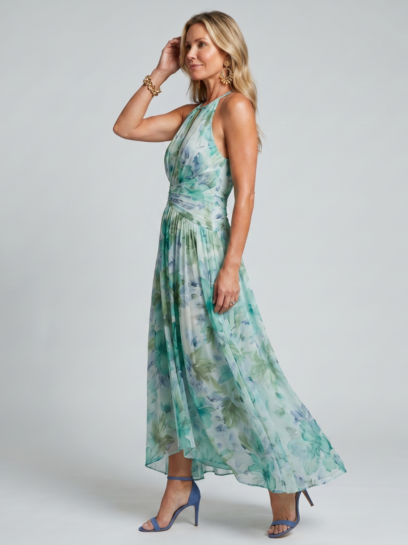 Petra – Plisserad halter midi-klänning med mjukt blommönster