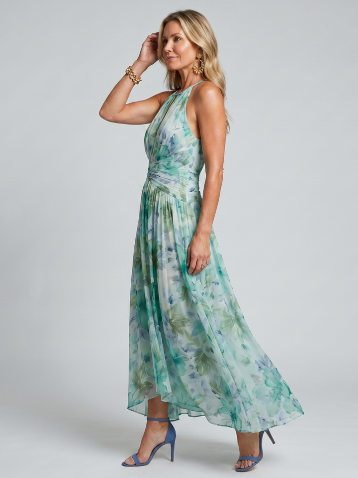 Petra – Plisserad halter midi-klänning med mjukt blommönster