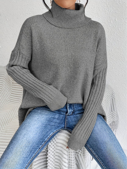 Elva – Oversized polotröja med asymmetrisk kant