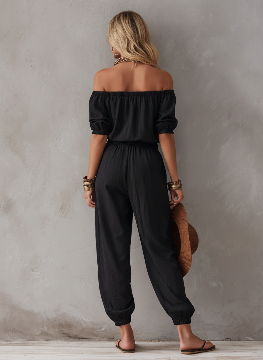 Maj – Avslappnad jumpsuit med off-shoulder-ringning