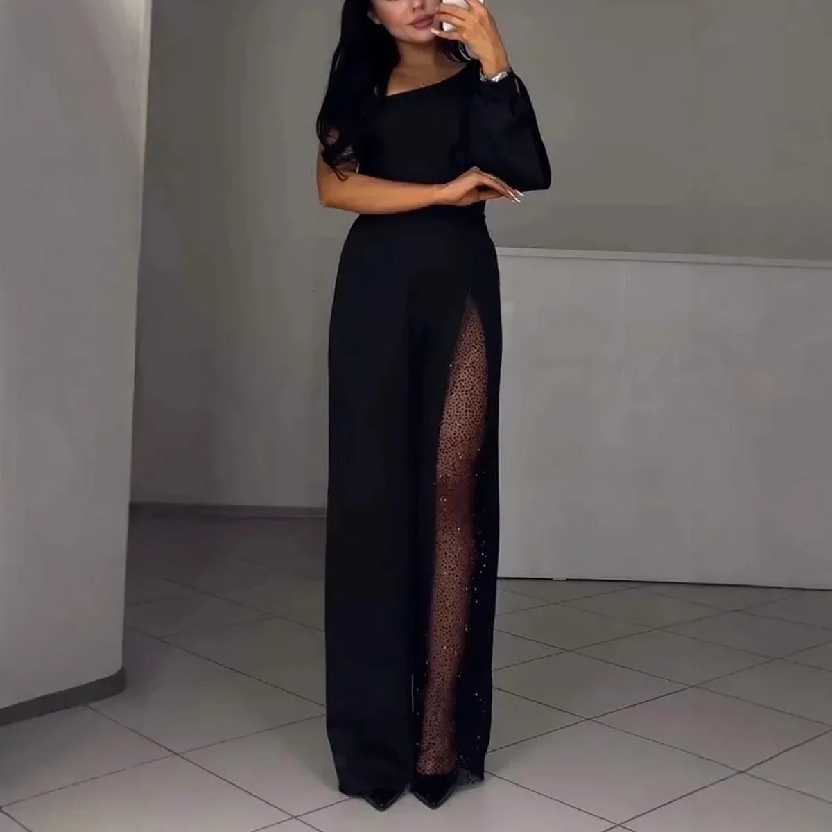 Martina – Elegant jumpsuit med meshdetalj