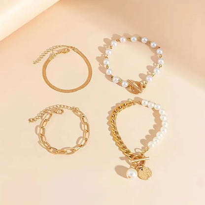 Vendela – Elegant 4-delat guldarmbandset med orm, pärlor och länkar