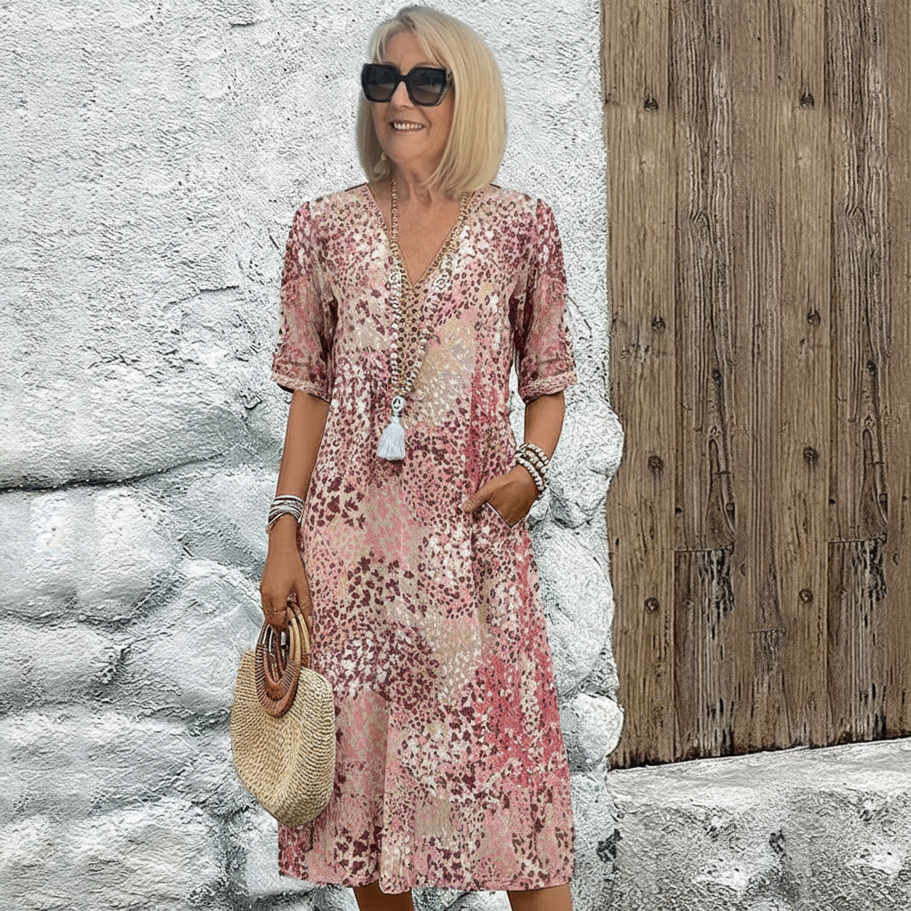 Olga – Blommig midiklänning med V-ringning