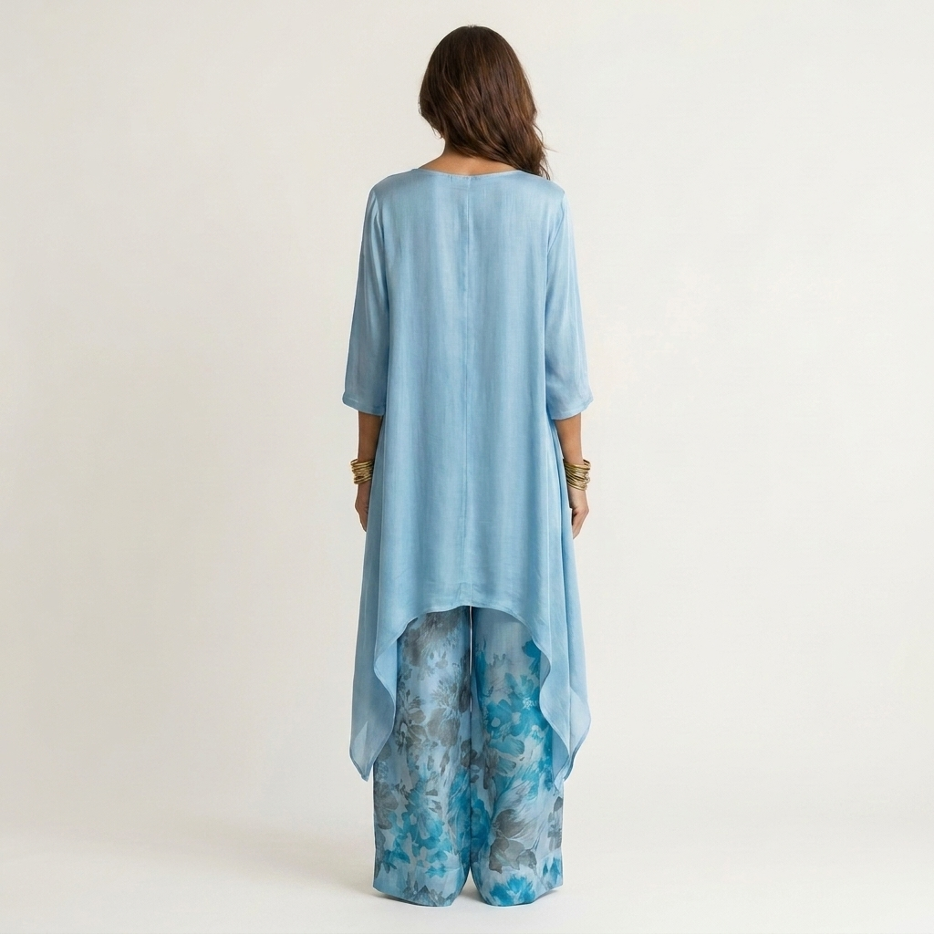 Maud – Asymmetriskt set med blommiga byxor