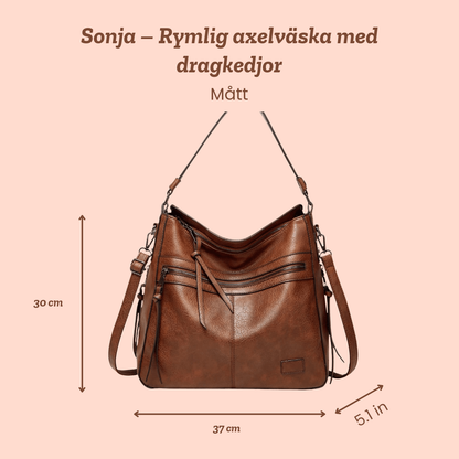Sonja – Rymlig axelväska med dragkedjor – handgjord av Astrid Göteborg