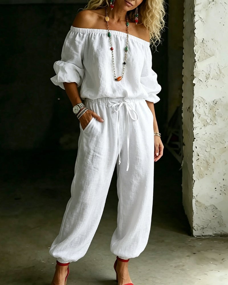 Vivi – Axelbandslös jumpsuit med puffärm