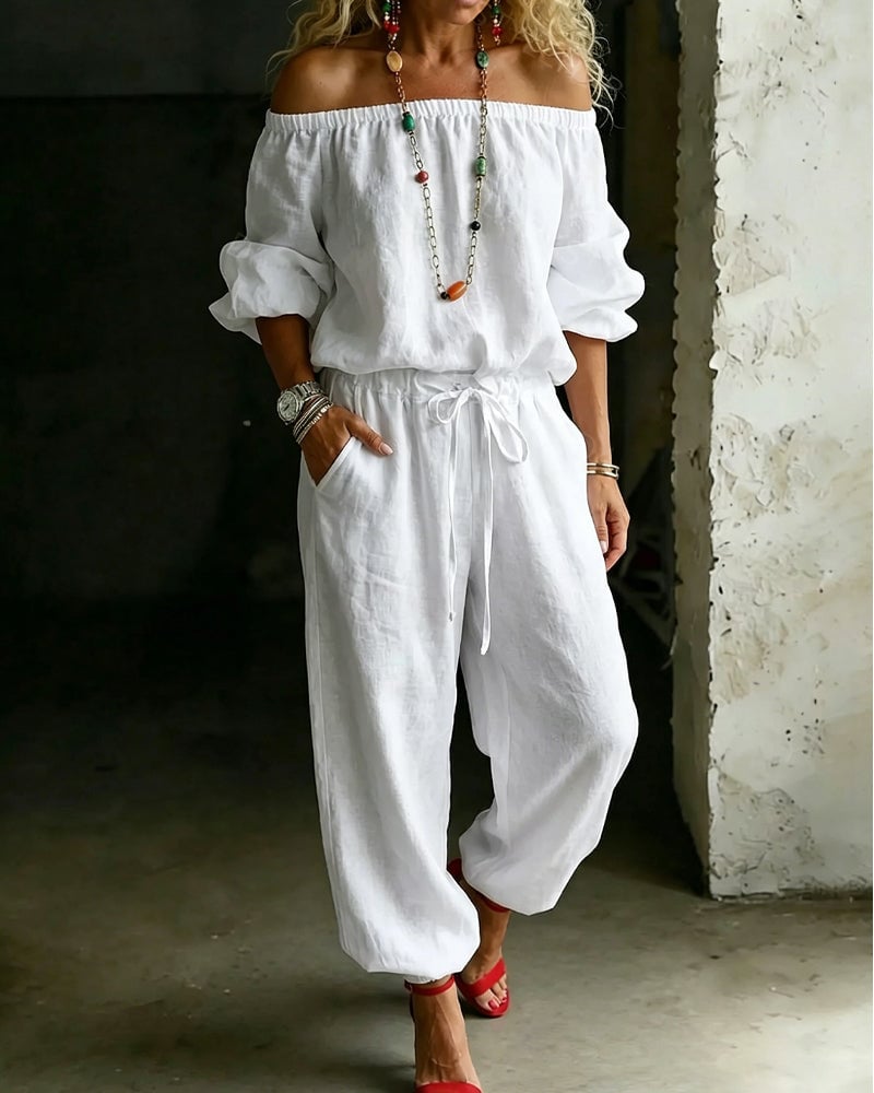 Vivi – Axelbandslös jumpsuit med puffärm
