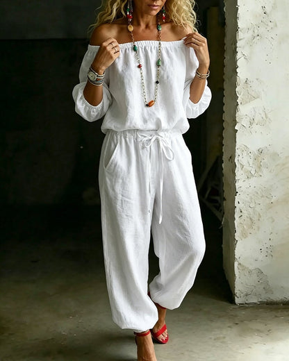Vivi – Axelbandslös jumpsuit med puffärm