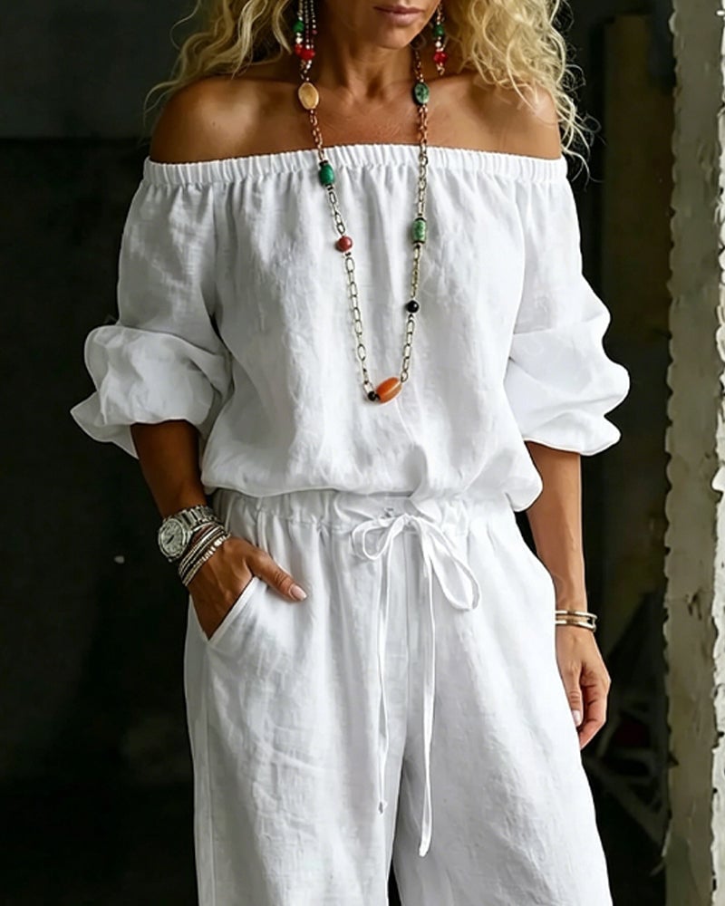 Vivi – Axelbandslös jumpsuit med puffärm